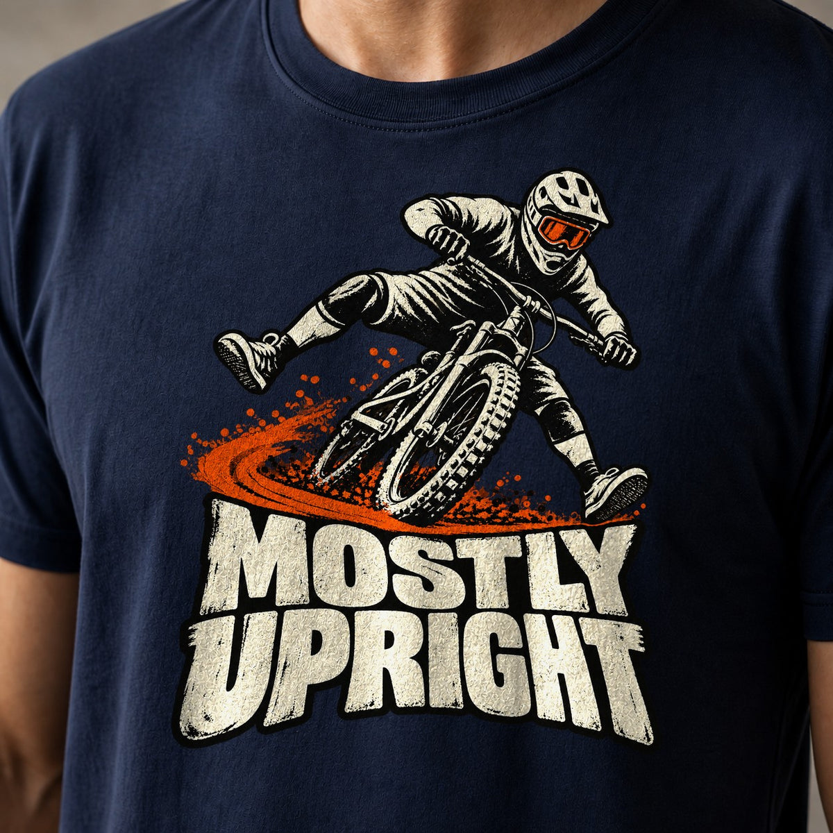 Mostly Upright funny mountain bike t-shirt in Navy — mountain biker leaning mid-save with front wheel washing out above Mostly Upright — close-up of the print