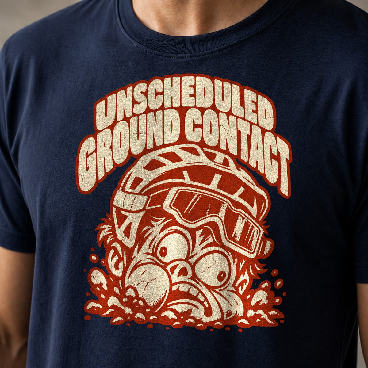 Unscheduled Ground Contact funny mountain bike t-shirt in Navy — mountain biker face planted in the dirt with goggles under Unscheduled Ground Contact — close-up of the print