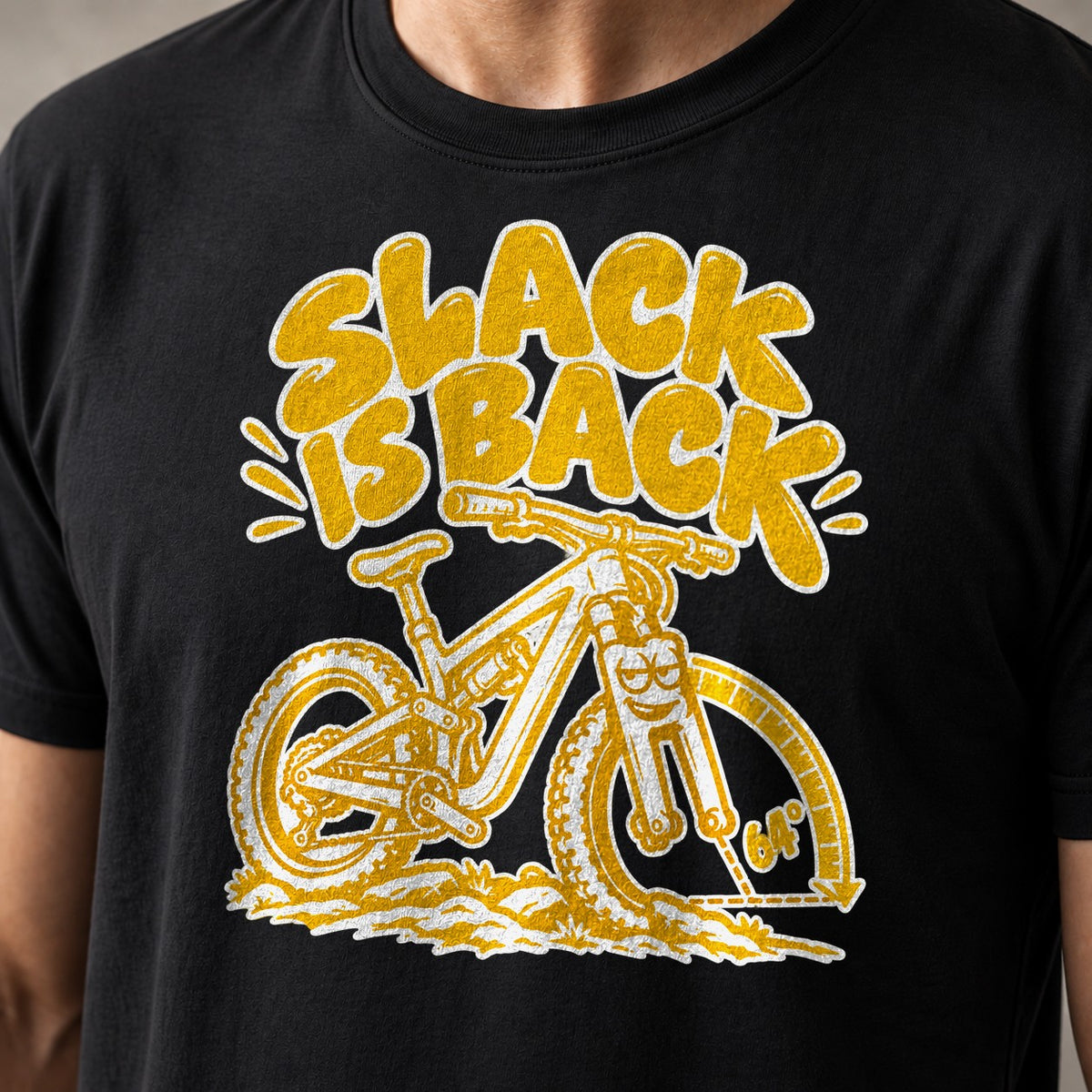 Slack Is Back funny mountain bike t-shirt in Black — cartoon enduro bike with a 64° head-angle arc — close-up of the print