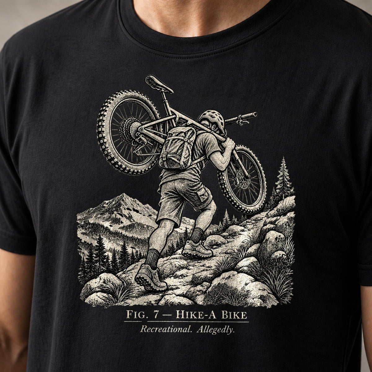 Fig. 7 Hike-A-Bike vintage mountain bike t-shirt in Black — fine-line engraving of a rider carrying a bike up a rocky alpine trail — close-up of the print