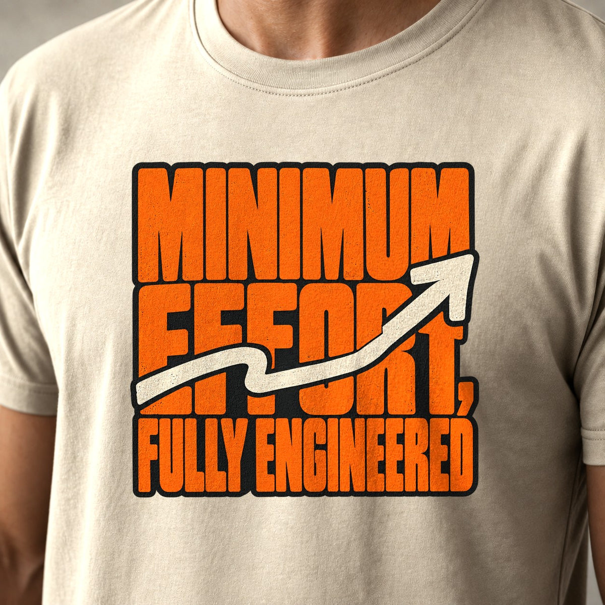 Minimum Effort, Fully Engineered mountain bike t-shirt in Natural — bold orange type with an arrow wriggling its way upward — close-up of the print