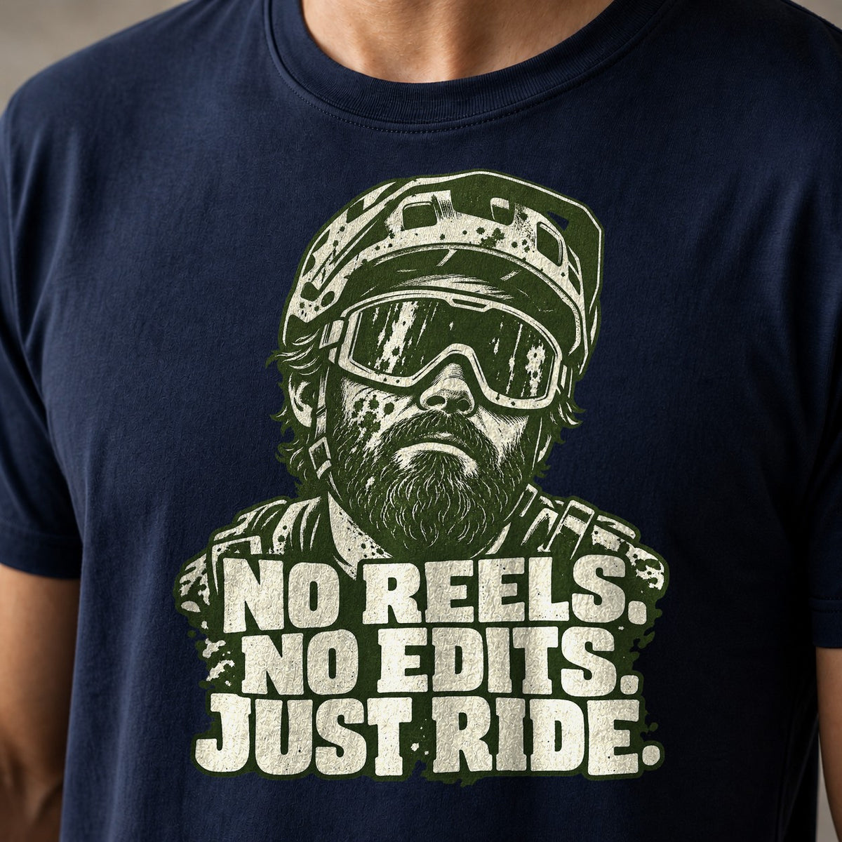 No Reels. No Edits. Just Ride. funny mountain bike t-shirt in Navy — portrait of a bearded mountain biker in helmet and goggles above No Reels No Edits Just Ride — close-up of the print