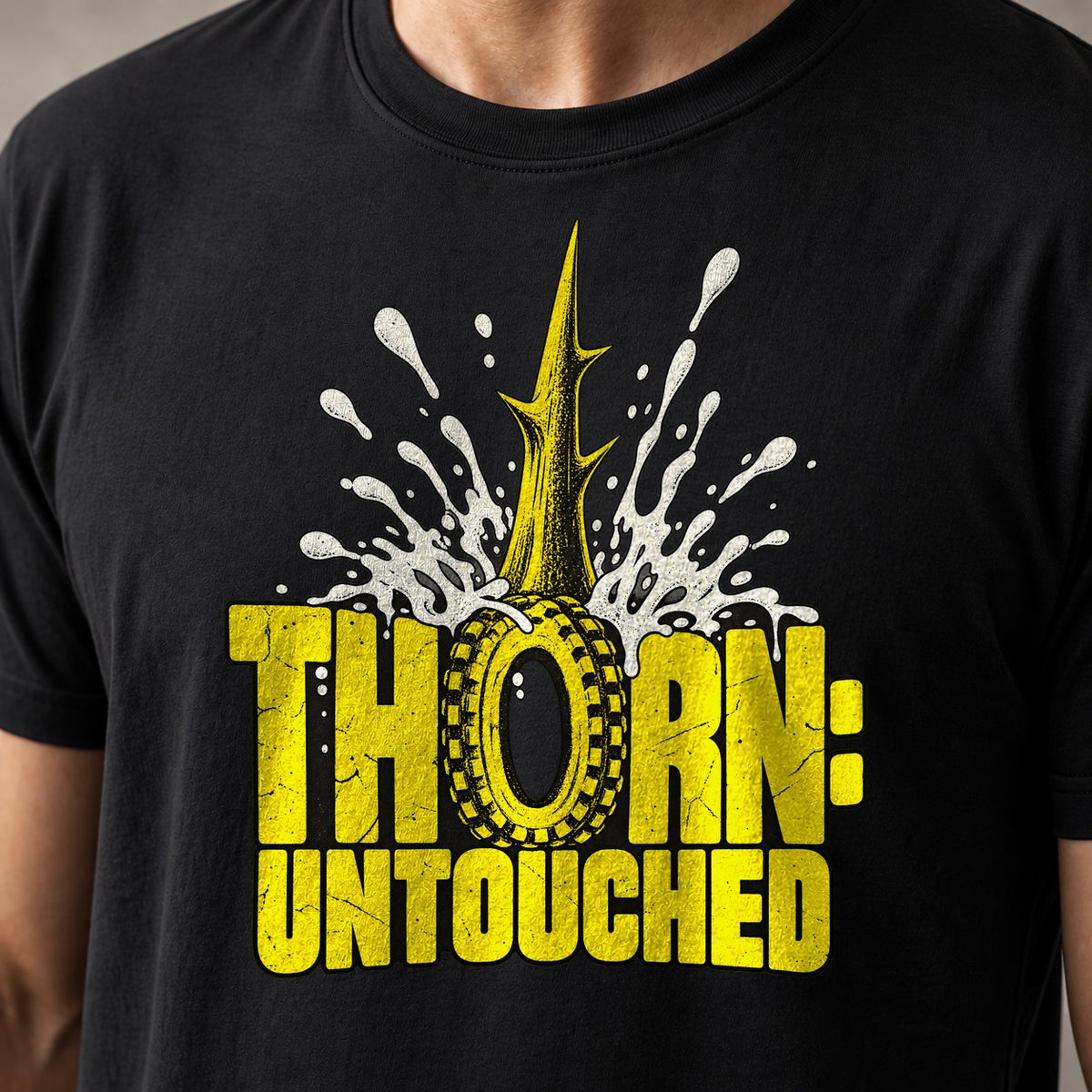 Thorn: Untouched funny mountain bike t-shirt in Black — thorn spike through a tire with sealant exploding around it — close-up of the print