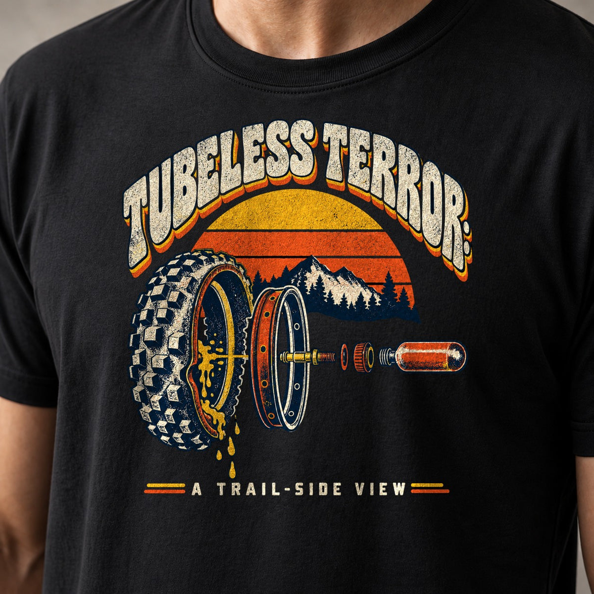 Tubeless Terror A Trail-Side View retro mountain bike t-shirt in Black — 70s sunset over mountains with an exploded view of a leaking tubeless tire, rim and valve — close-up of the print