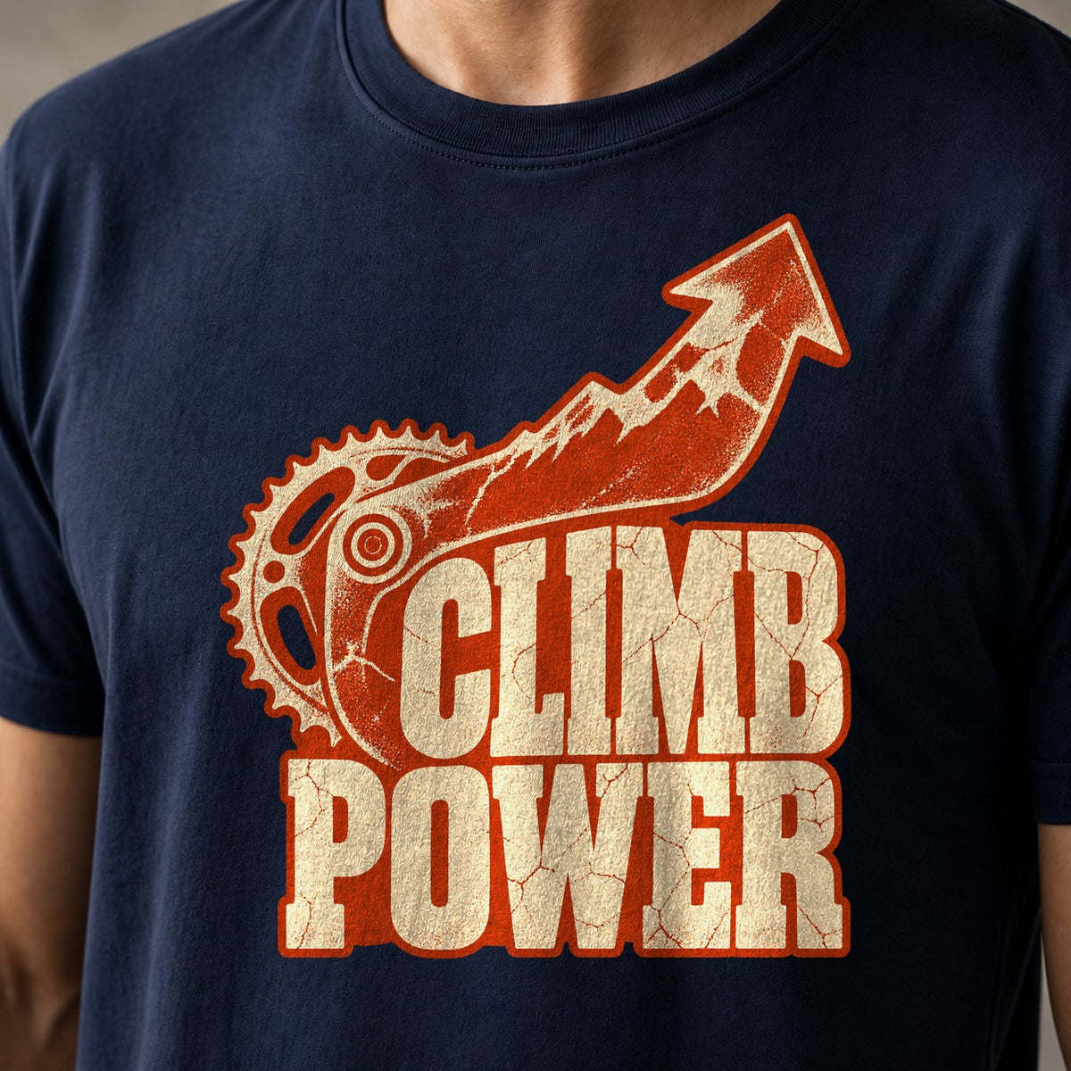 Climb Power funny mountain bike t-shirt in Navy — chainring and mountain arrow pointing up above Climb Power lettering — close-up of the print