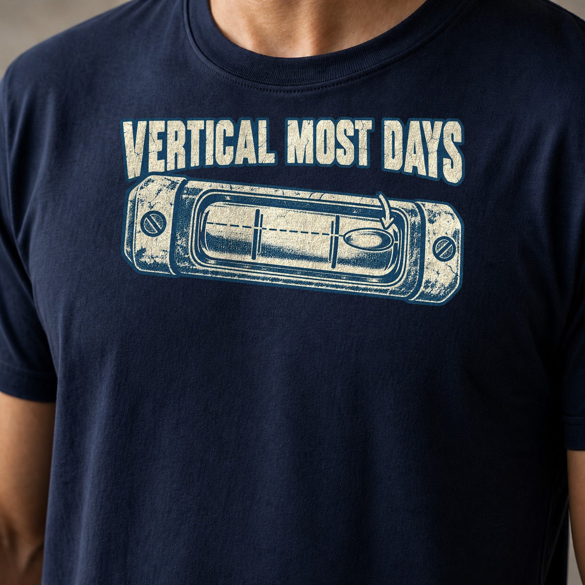 Vertical Most Days funny mountain bike t-shirt in Navy — spirit level with the bubble pushed off center under Vertical Most Days — close-up of the print