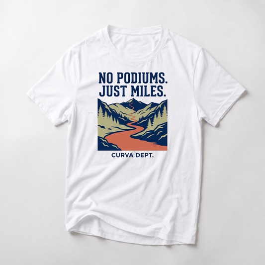 White t-shirt with mountain graphic and text 'No Podiums. Just Miles.' on a white background