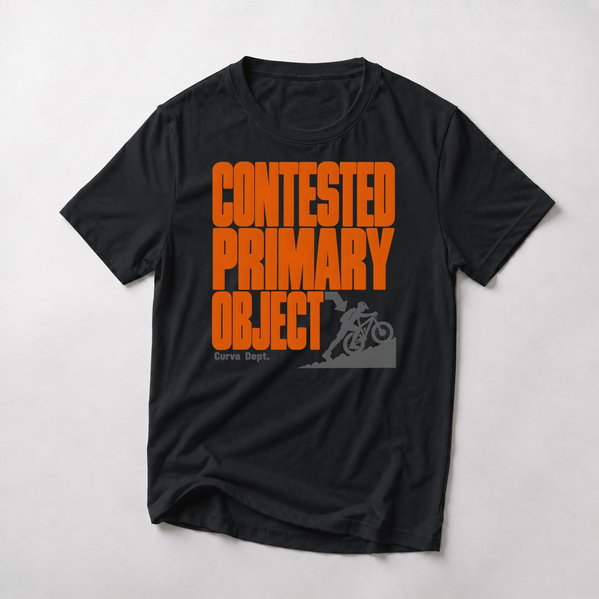Contested Primary Object mountain bike t-shirt in Black — rider shoving his bike up a slope beside stacked orange type