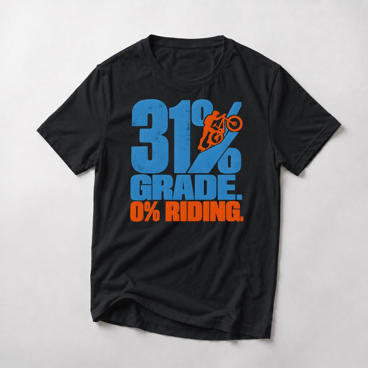 31% Grade. 0% Riding. mountain bike t-shirt in Black — tiny rider pushing his bike up the slash of a giant percent sign