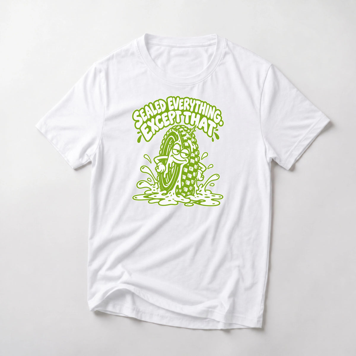 Sealed Everything. Except That. funny mountain bike t-shirt in White — smug cartoon tire sitting in a puddle of sealant