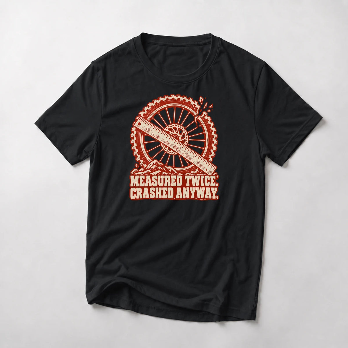 Measured Twice. Crashed Anyway. funny mountain bike t-shirt in Black — woodcut wheel and ruler with a cracked rim