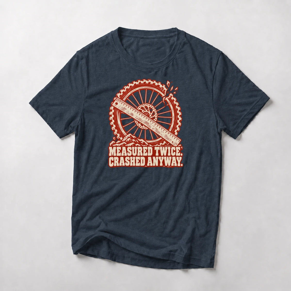 Measured Twice. Crashed Anyway. funny mountain bike t-shirt in Navy — woodcut wheel and ruler with a cracked rim