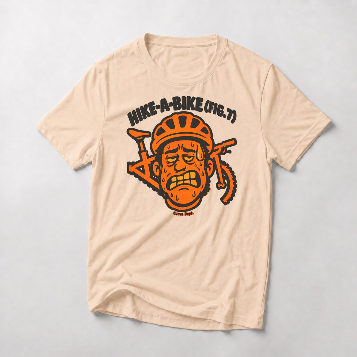 Hike-A-Bike (Fig. 7) mountain bike t-shirt in Natural — grimacing cartoon rider in an orange helmet with the bike behind his head