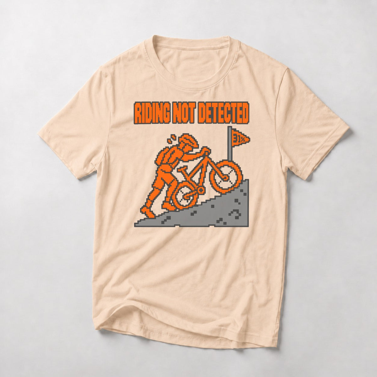 Riding Not Detected mountain bike t-shirt in Natural — 8-bit rider pushing his bike up a pixel climb to a 31% flag