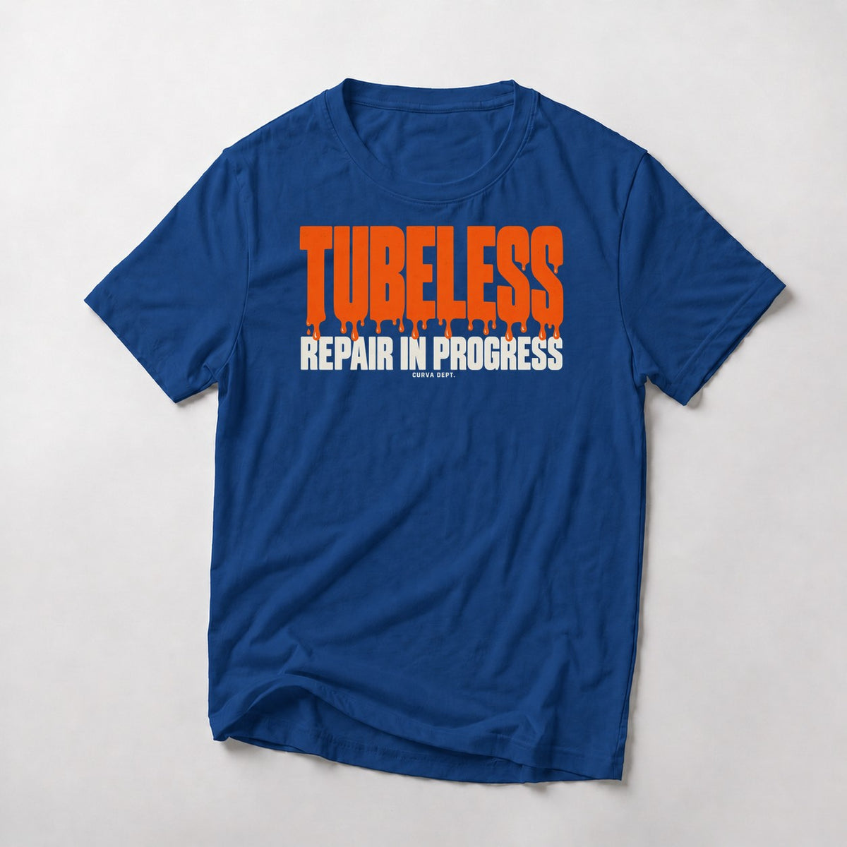 Tubeless. Repair In Progress. mountain bike t-shirt in Royal — big orange block letters dripping sealant