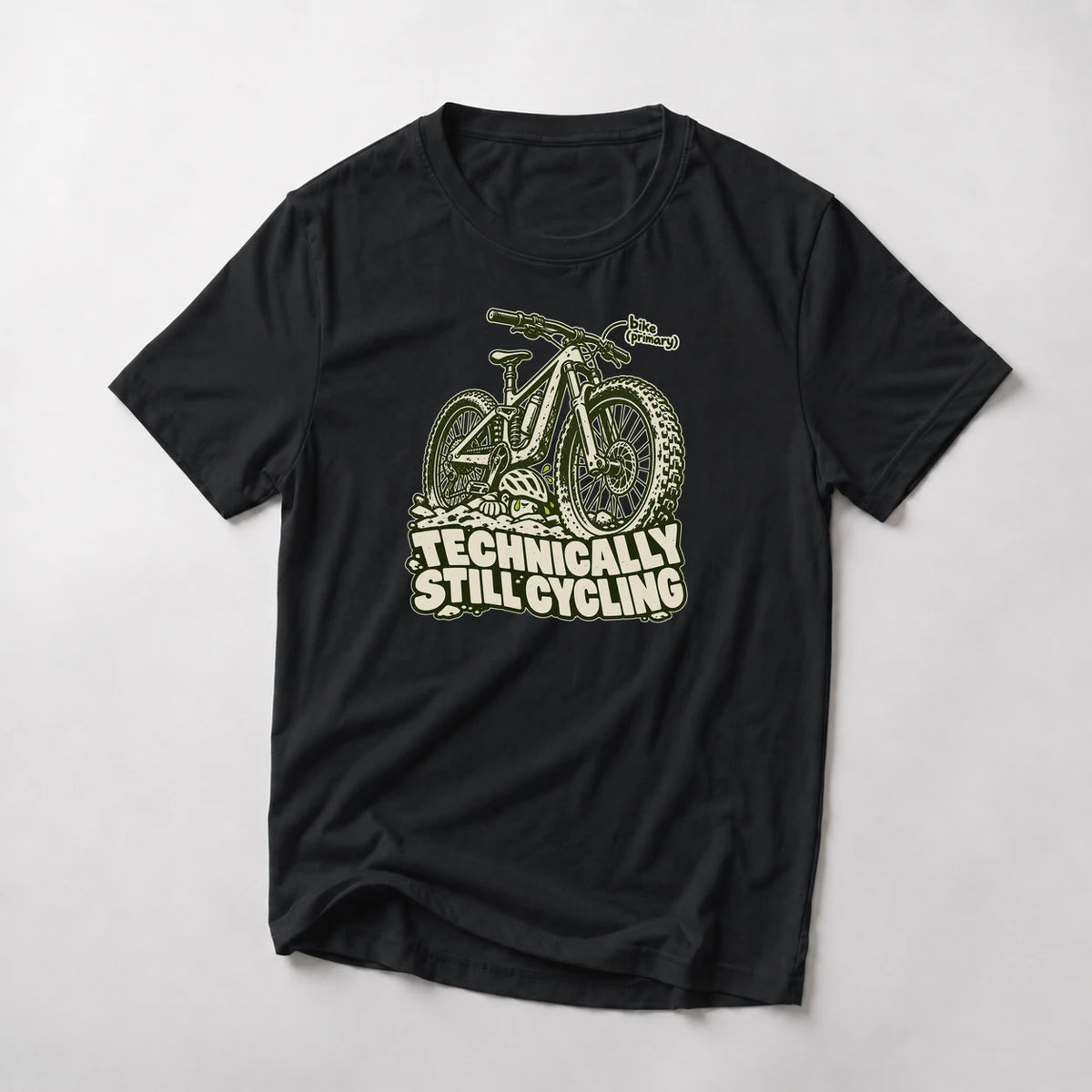 Technically Still Cycling funny mountain bike t-shirt in Black — chunky fat-tire trail bike on a pile of rocks