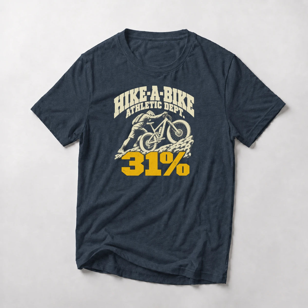 Hike-A-Bike Athletic Dept. 31% funny mountain bike t-shirt in Navy — college-style lettering over a rider pushing up a rock face