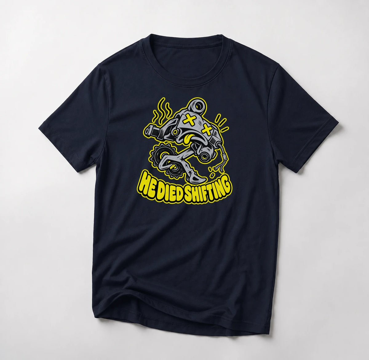 He Died Shifting funny mountain bike t-shirt in Navy — cartoon rear derailleur with X eyes and snapped cable above He Died Shifting text