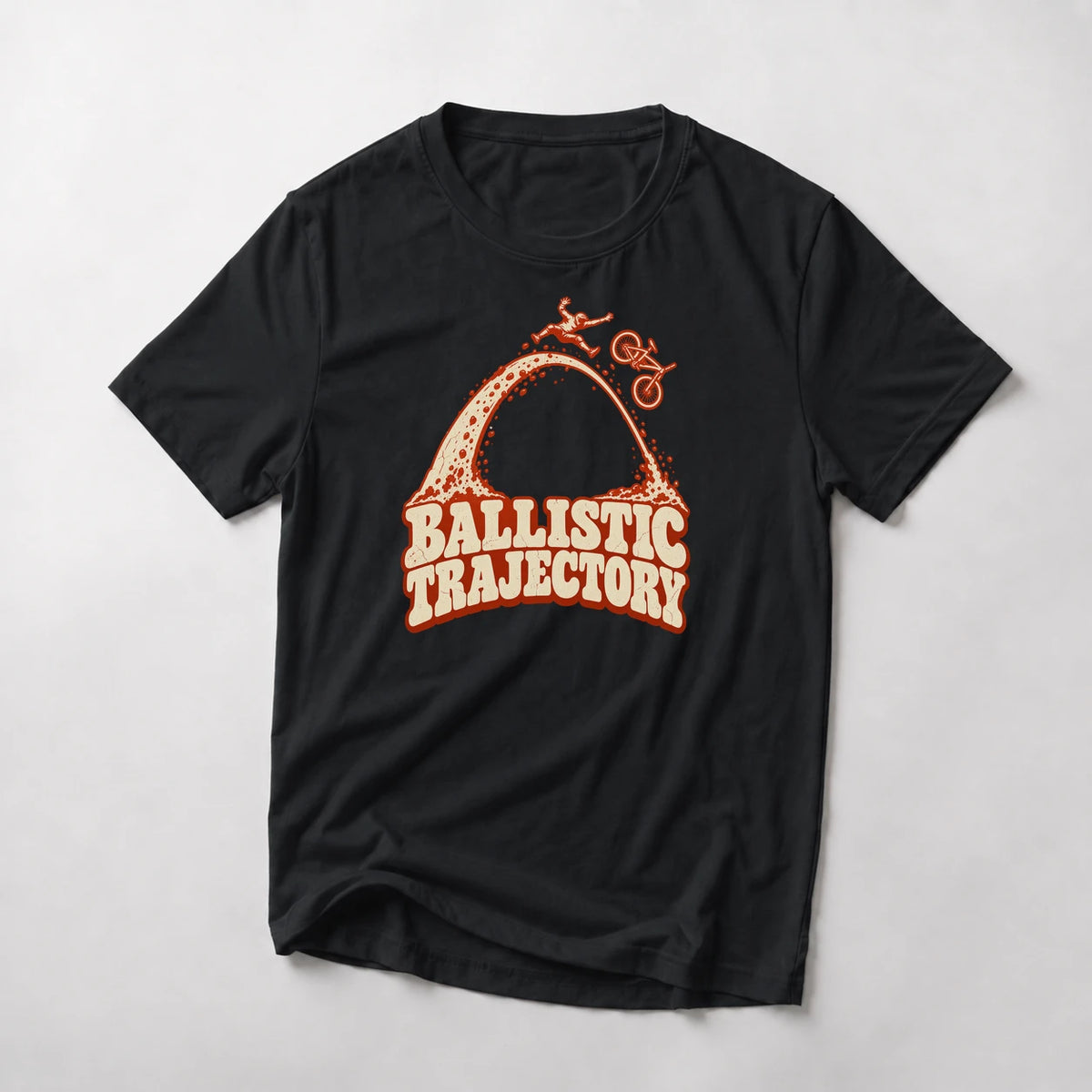 Ballistic Trajectory funny mountain bike t-shirt in Black — rider separating from his bike at the apex of a big dirt arc above Ballistic Trajectory lettering