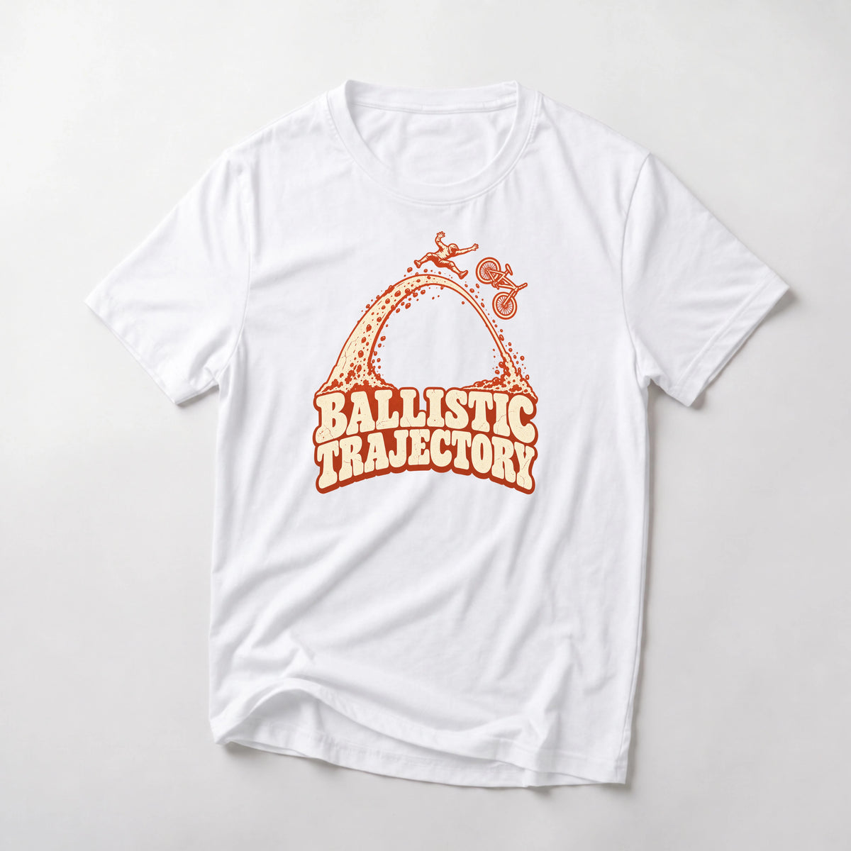 Ballistic Trajectory funny mountain bike t-shirt in White — rider separating from his bike at the apex of a big dirt arc above Ballistic Trajectory lettering