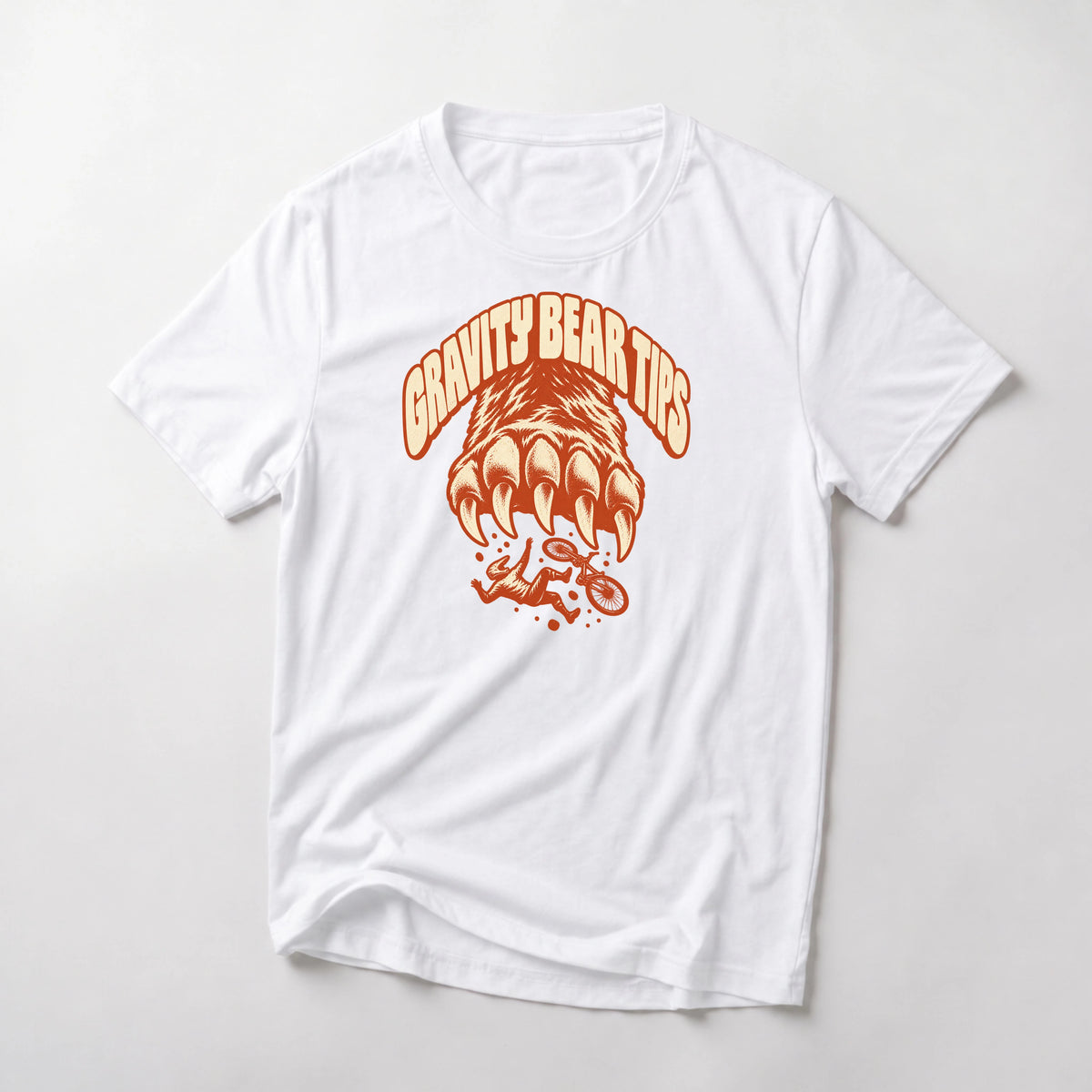 Gravity Bear Tips funny mountain bike t-shirt in White — giant bear paw with claws above a small tumbling mountain biker under Gravity Bear Tips