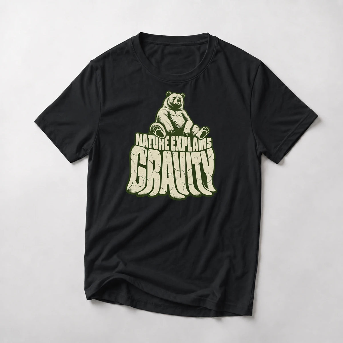 Nature Explains Gravity funny mountain bike t-shirt in Black — bear sitting on top of sagging Gravity letters under Nature Explains text