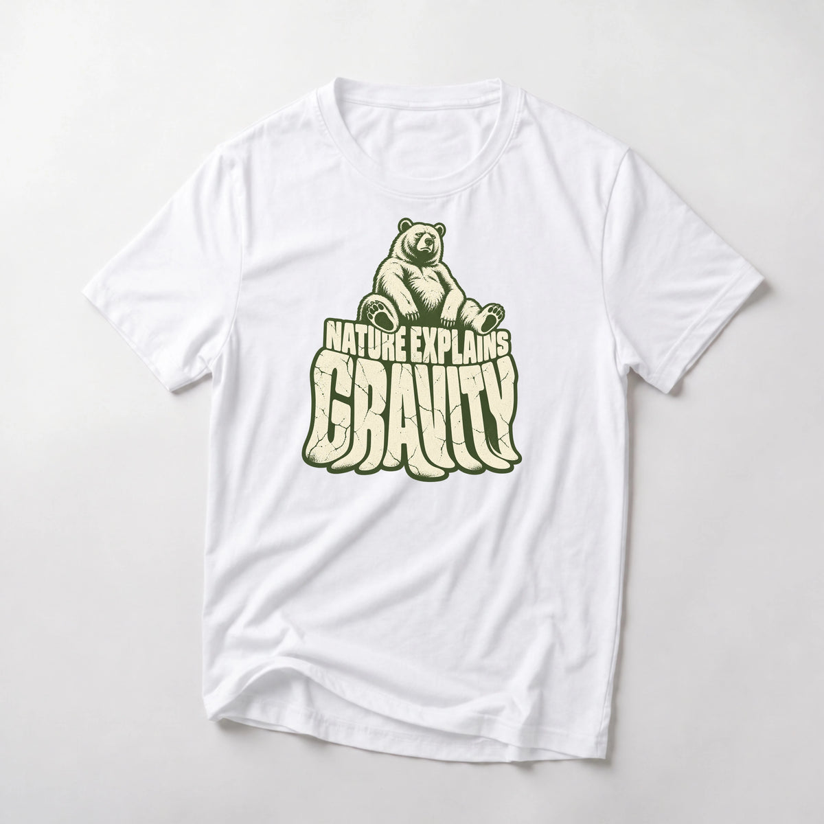 Nature Explains Gravity funny mountain bike t-shirt in White — bear sitting on top of sagging Gravity letters under Nature Explains text