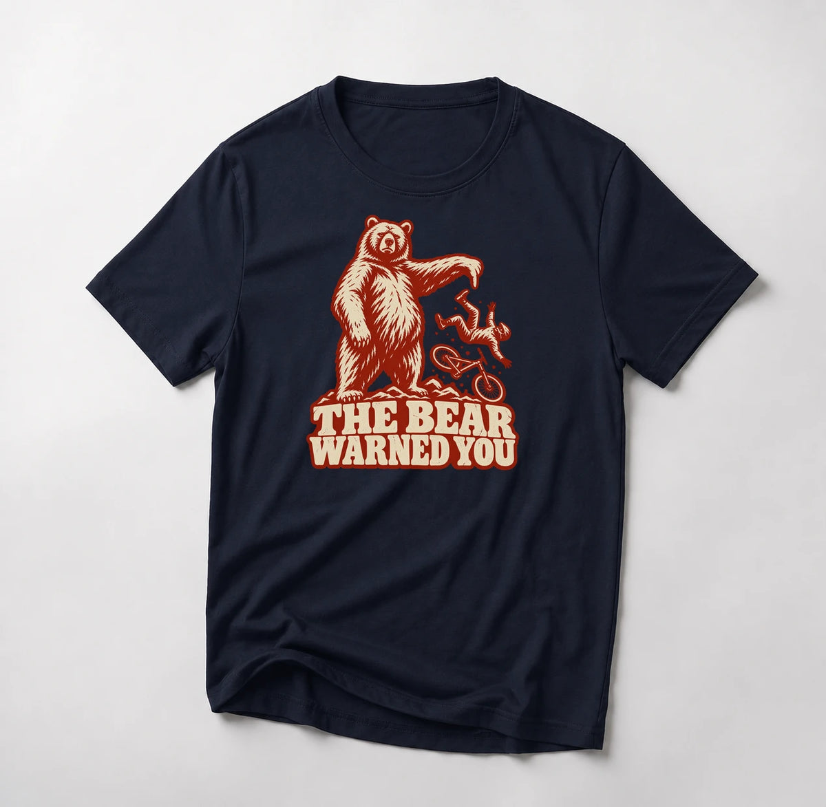 The Bear Warned You funny mountain bike t-shirt in Navy — standing bear pointing at a mountain biker going over the bars above The Bear Warned You