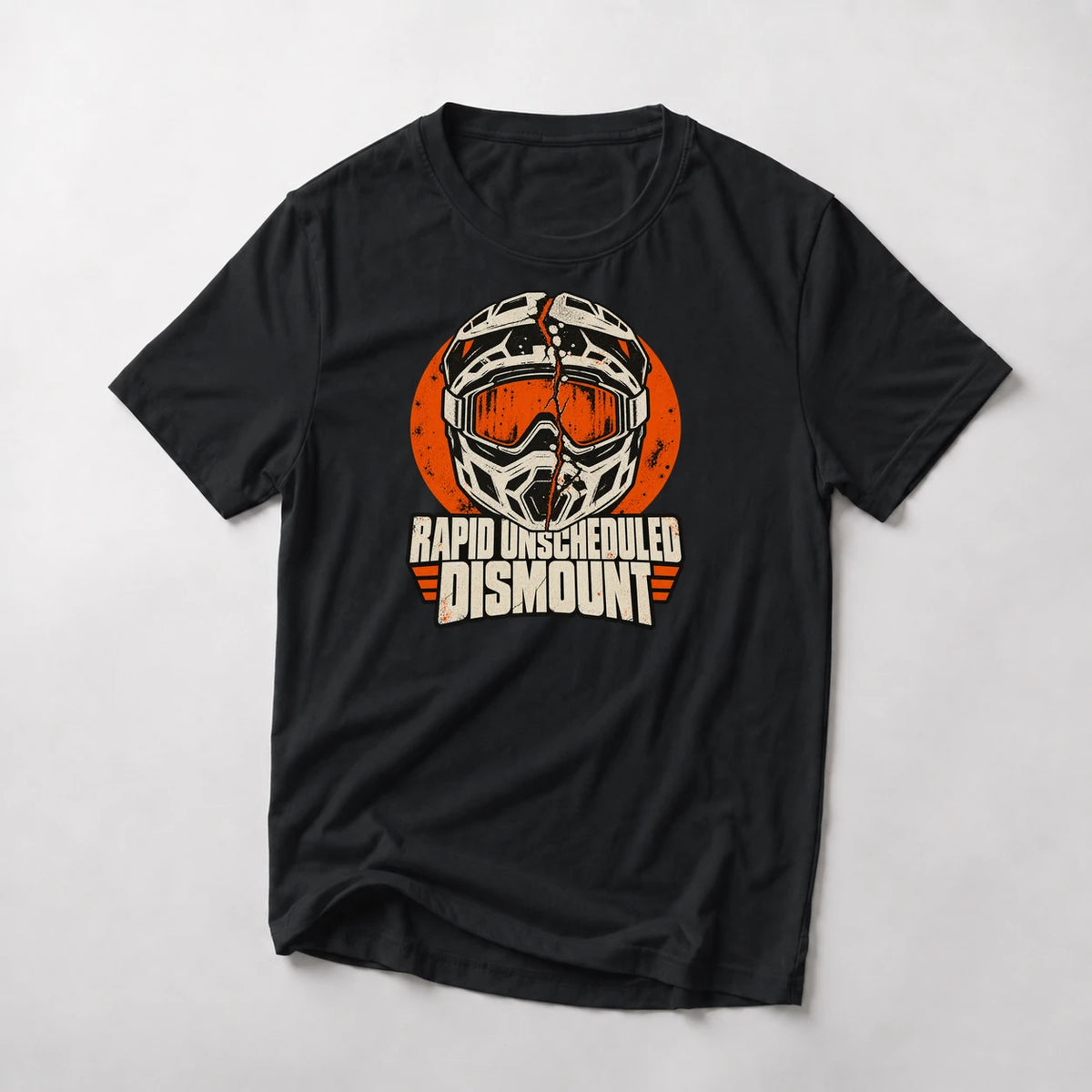 Rapid Unscheduled Dismount funny mountain bike t-shirt in Black — cracked full-face mountain bike helmet on an orange circle above Rapid Unscheduled Dismount