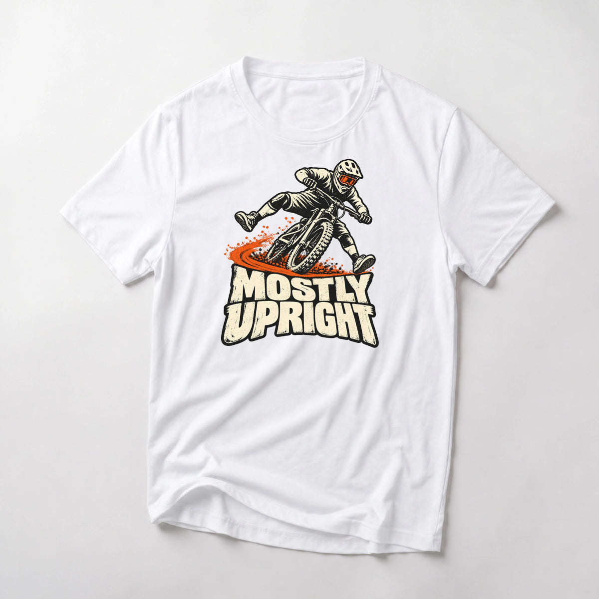 Mostly Upright funny mountain bike t-shirt in White — mountain biker leaning mid-save with front wheel washing out above Mostly Upright