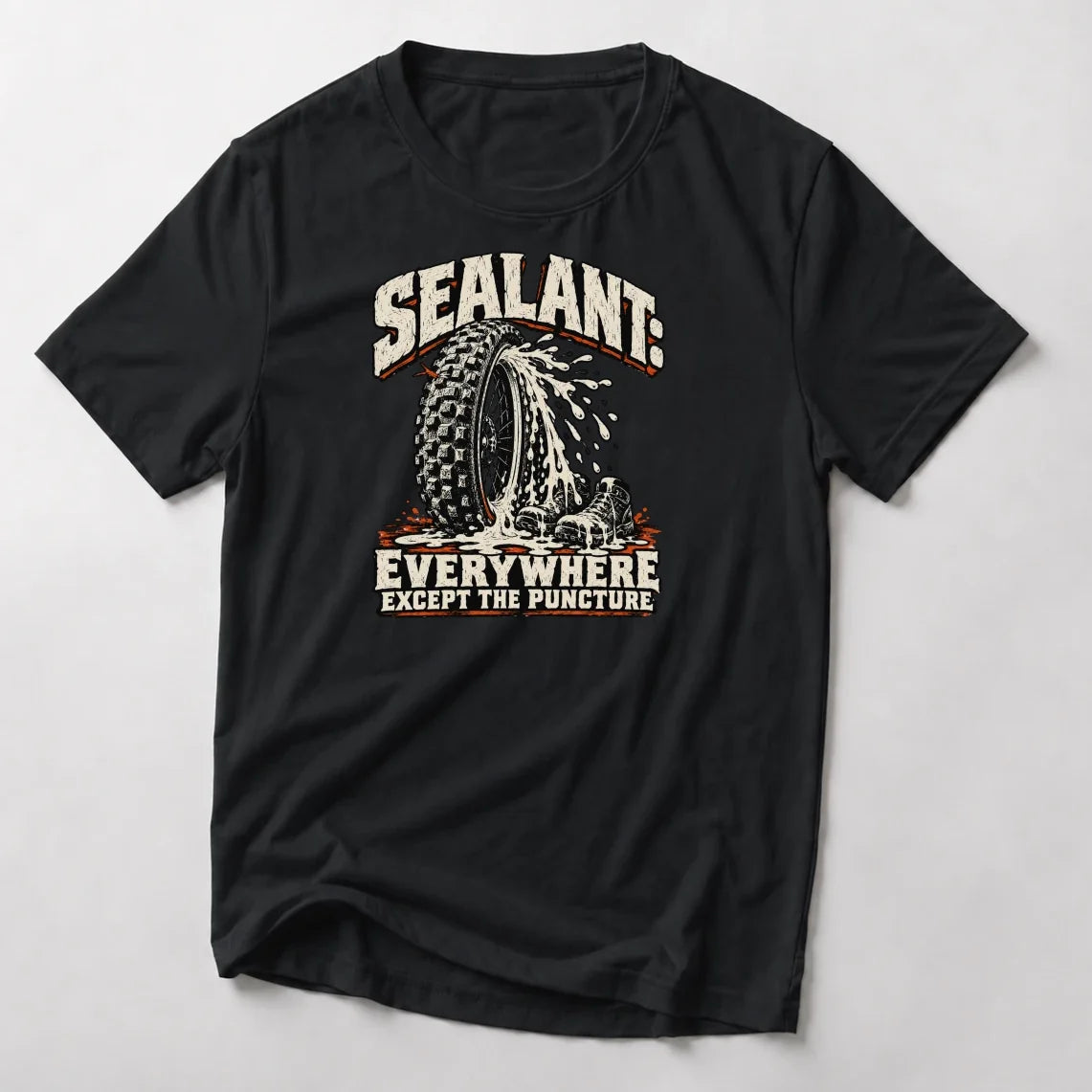 Sealant Everywhere Except The Puncture funny mountain bike t-shirt in Black — woodcut tire spraying sealant over a pair of riding shoes