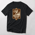 Hike-A-Bike Section Next 2 KM mountain bike t-shirt in Black — brown park-style trail sign of a rider carrying a bike uphill